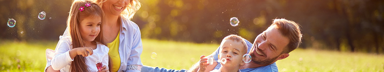 Family playing in a park