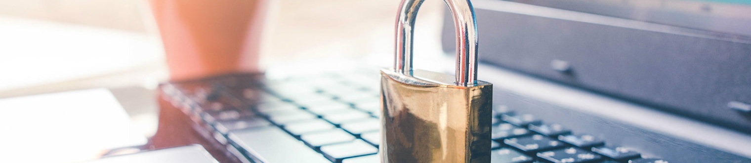 a brass lock on a laptop keyboard