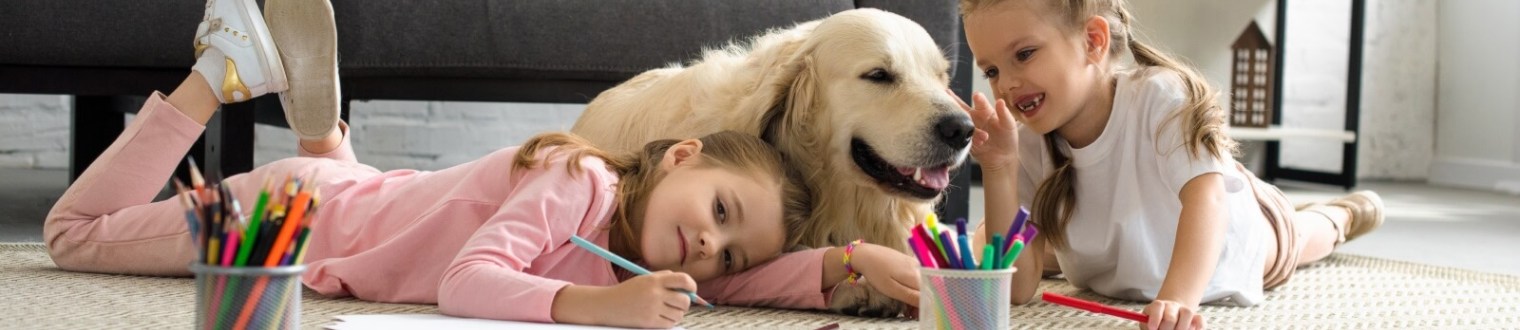 little girls playing with their dog
