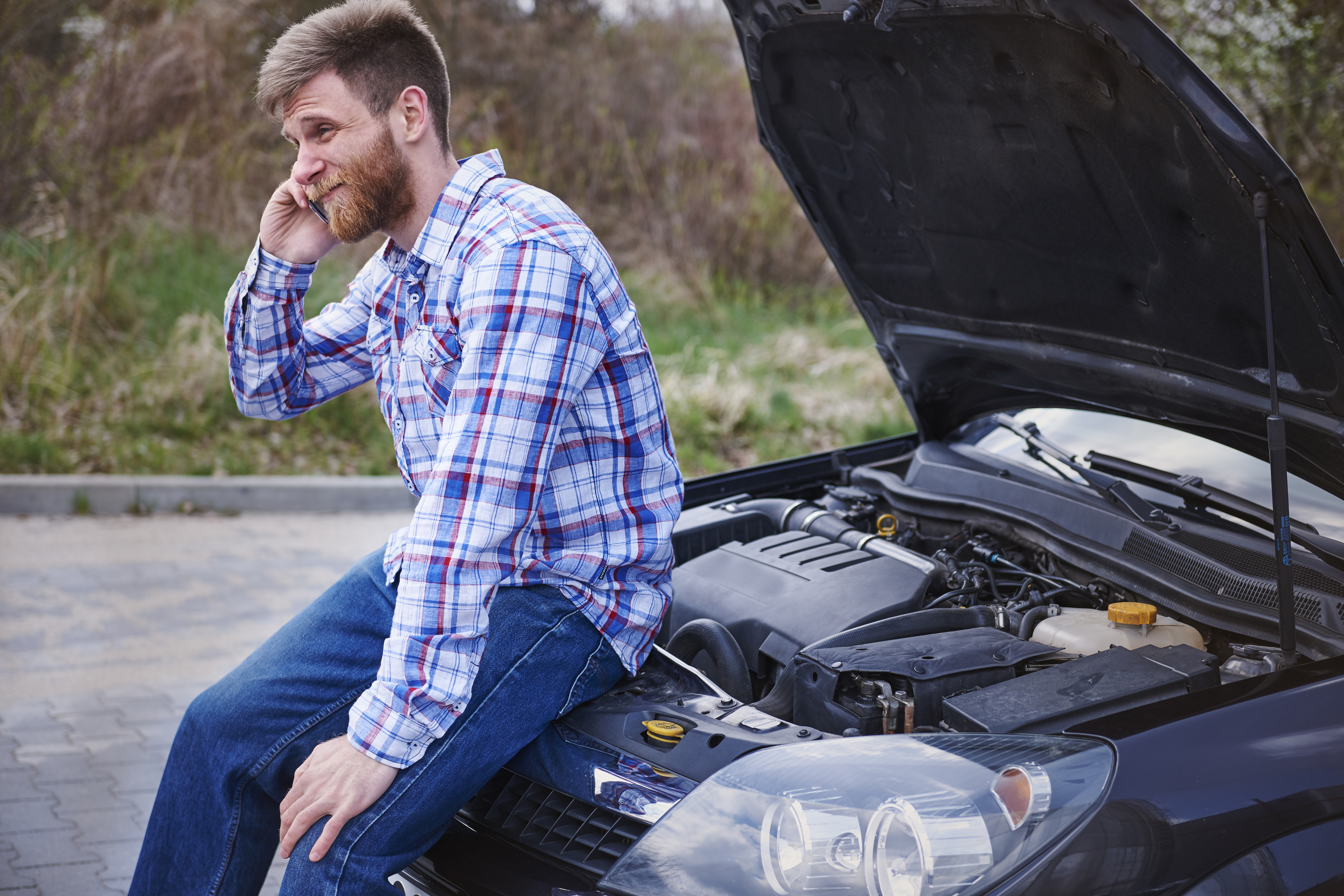 Man calling for help after his car breaks down