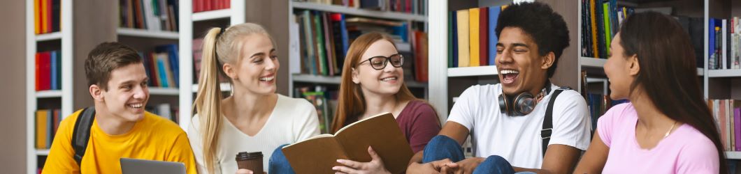 Image of friends laughing at the library.