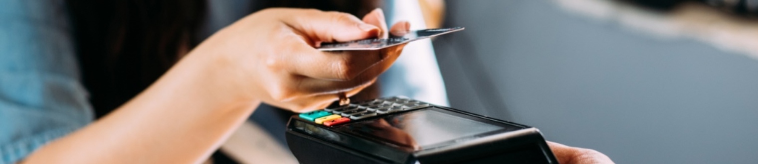a person making a credit/debit card purchase